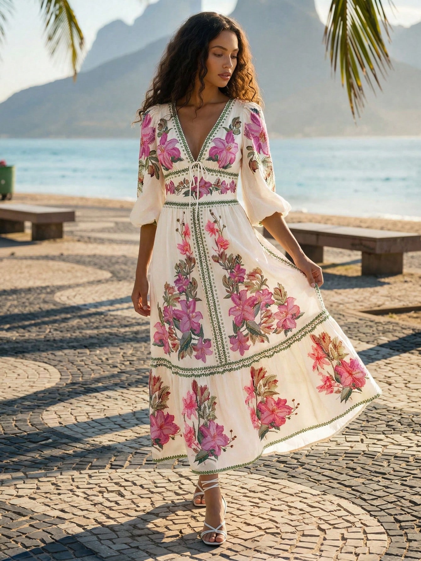 Vestido floral CAJUNI com flores rosas e detalhes verdes, fotografado pela loja